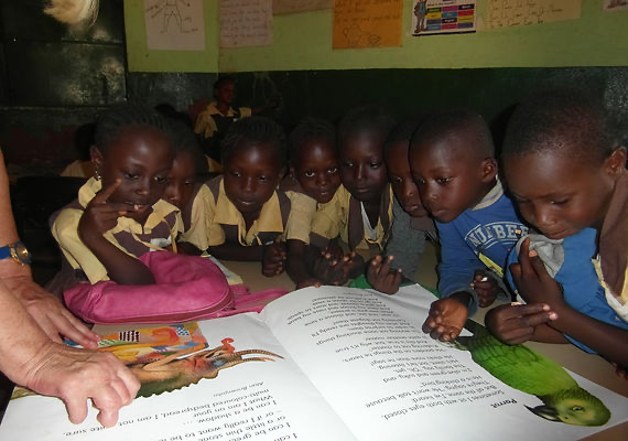 Children reading together at a partner school